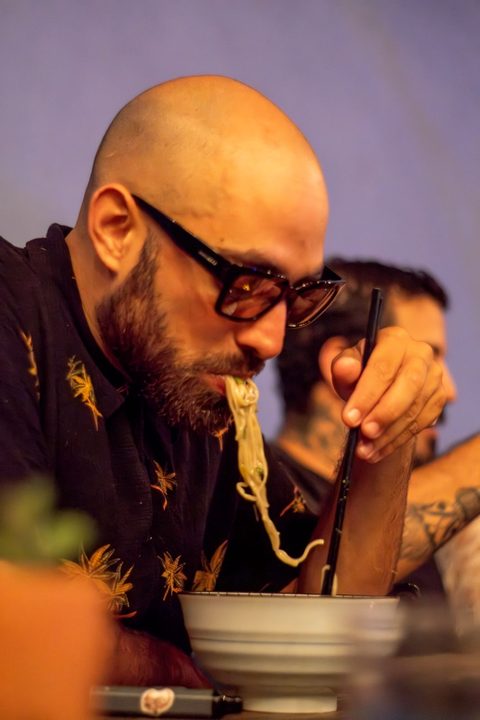 Guest savoring ramen noodles